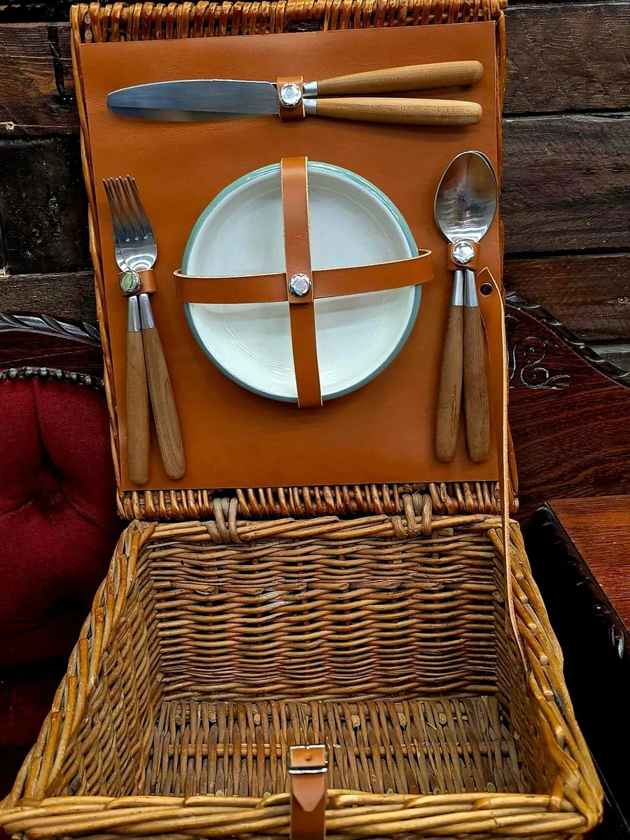 The same hamper with a new tan leather panel and straps