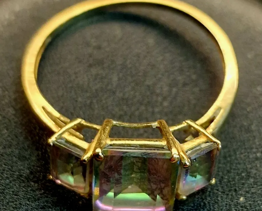 Gold ring with mystic topaz stones, before being resized and reinforced