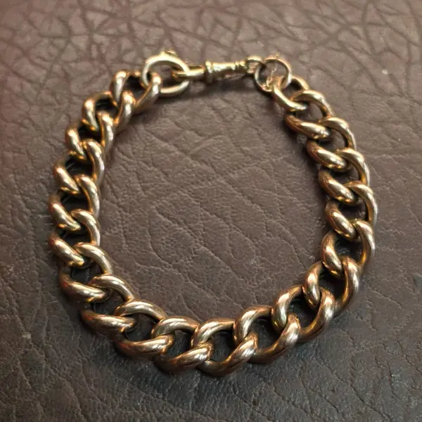Antique gold curb-link bracelet on leather