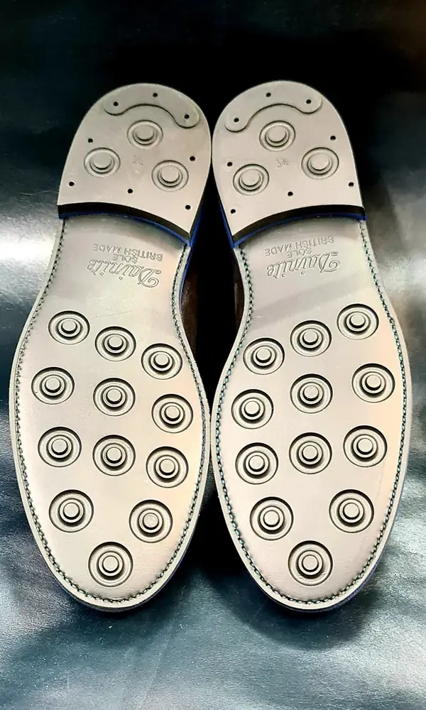 Shoes with new studded rubber soles