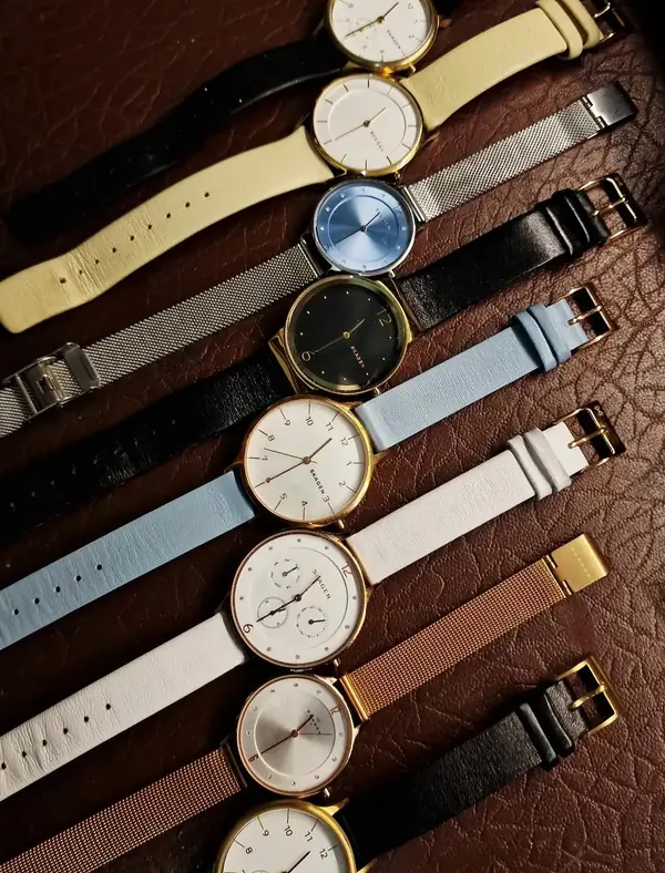 A row of watches on leather and mesh straps