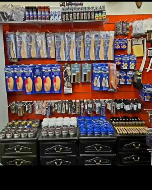 Insoles, laces and shoe care products on display