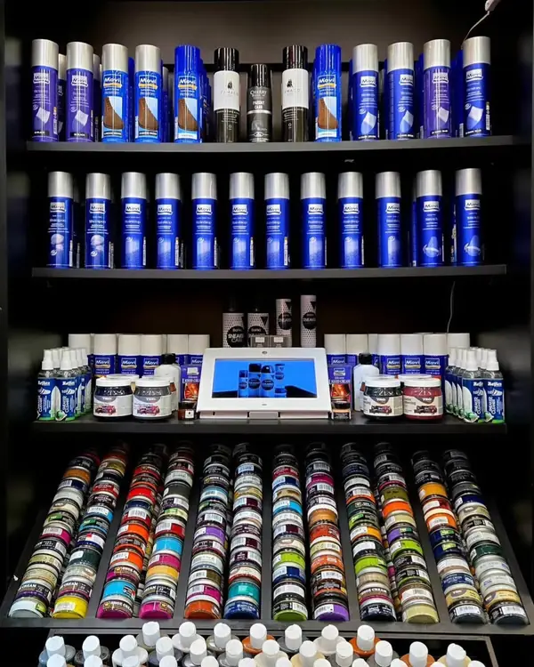 Shelves of shoe care sprays, polishes and dyes