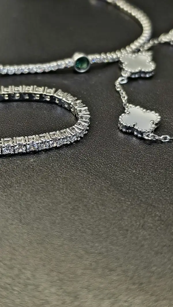 Silver necklaces and a tennis bracelet
